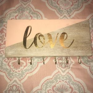 A wood board with hooks